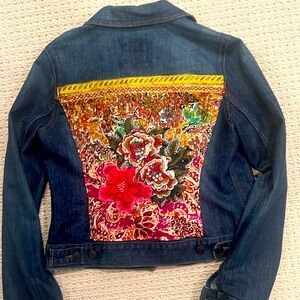 Gorgeous one of a kind upcycled denim jacket. Size medium.